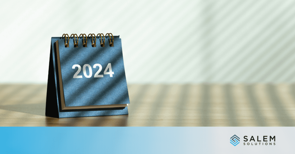 A desk calendar sitting on top of a wooden table.