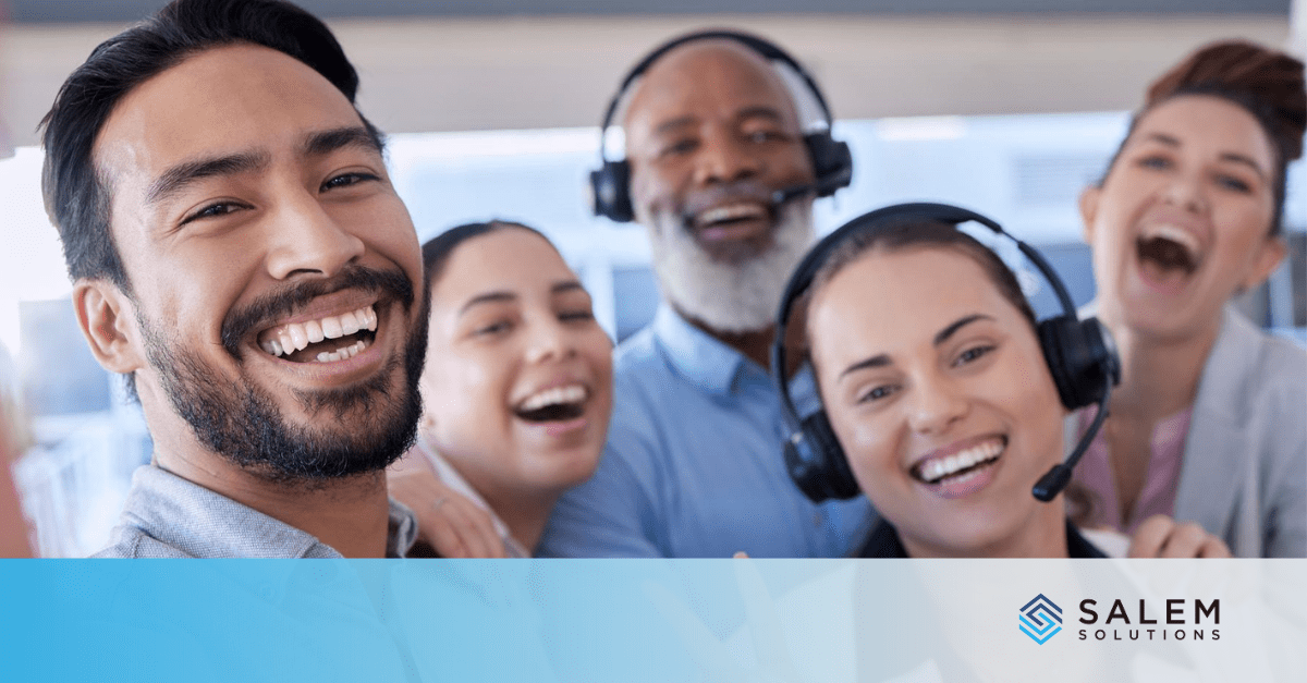 A group of people wearing headsets and smiling.