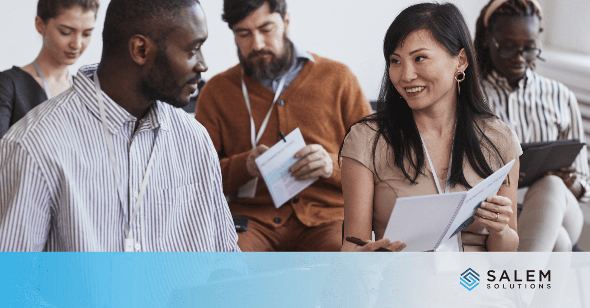 Diverse team reviewing federal compliance documents for government staffing requirements.