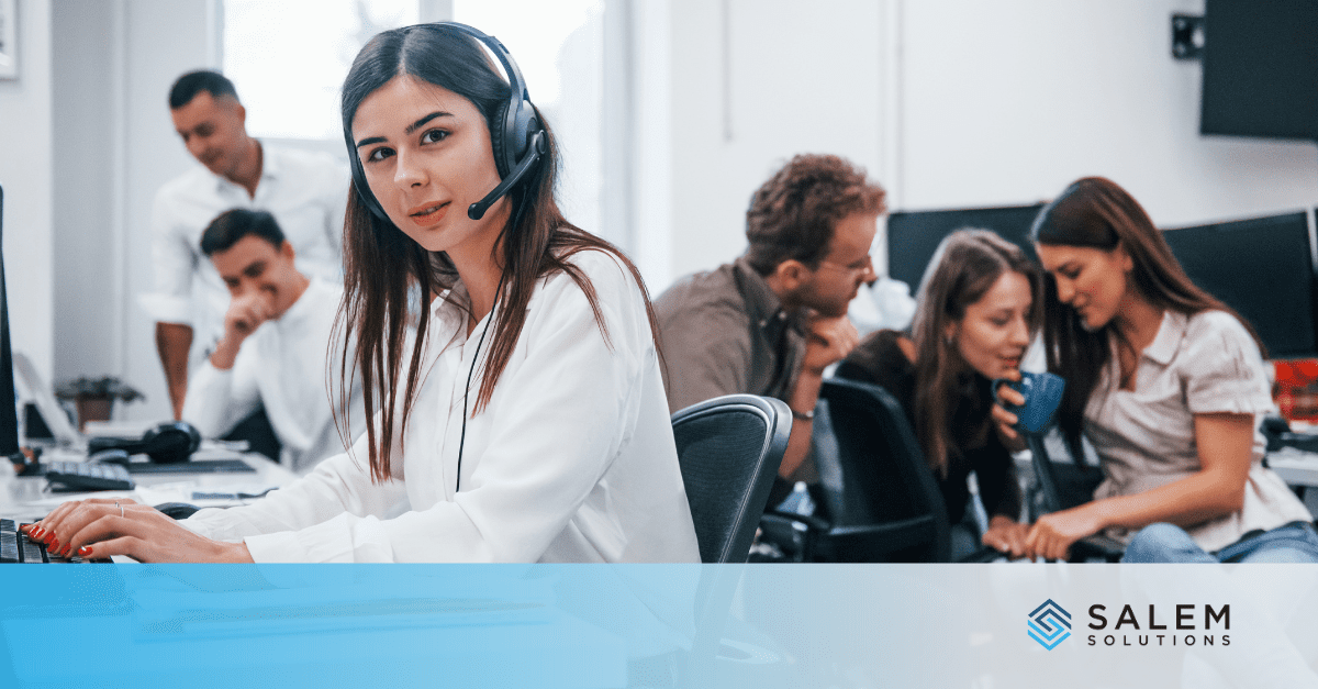 Customer service representative with headset in call center for federal enrollment support.