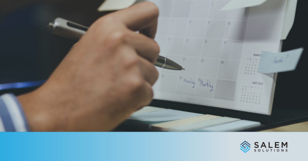 Professional planning Q1 attrition prevention strategies by scheduling workforce and onboarding meetings on calendar.