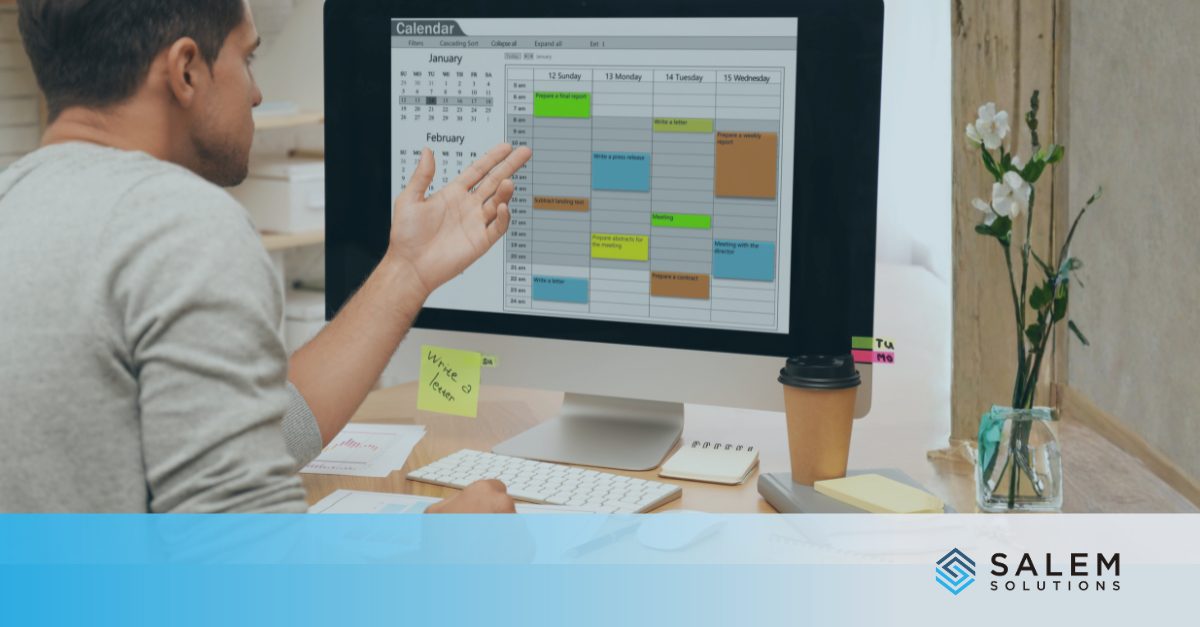 Professional reviewing digital calendar to prevent staffing gaps through strategic Q1 scheduling.